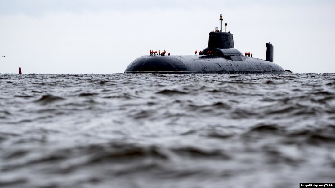 U.S. military officials told reporters that the submarine surfaced during a war-game exercise. (file photos)