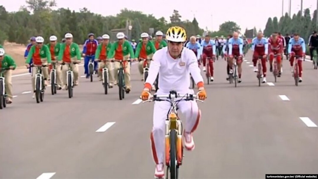 Turkmen President Gurbanguly Berdymukhammedov rides his bike in Ashgabat on June 1 as part of a mass ride that set a Guinness world record.