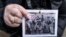 POLAND -- Holocaust survivor and former prisoner of the Nazi death camp Auschwitz-Birkenau, Miriam Ziegler (Friedman), shows a historical picture of her and other prisoners in Oswiecim on January 26, 2020, 