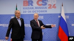 Russian President Vladimir Putin gestures during a meeting with his Iranian counterpart, Masud Pezeshkian, on the sidelines of the BRICS summit in Kazan, Russia, on October 23. Russia has drawn closer to Iran and has tapped into widespread grievances against Israel and the West in a bid to bolster its global clout and blunt criticism of its war on Ukraine.