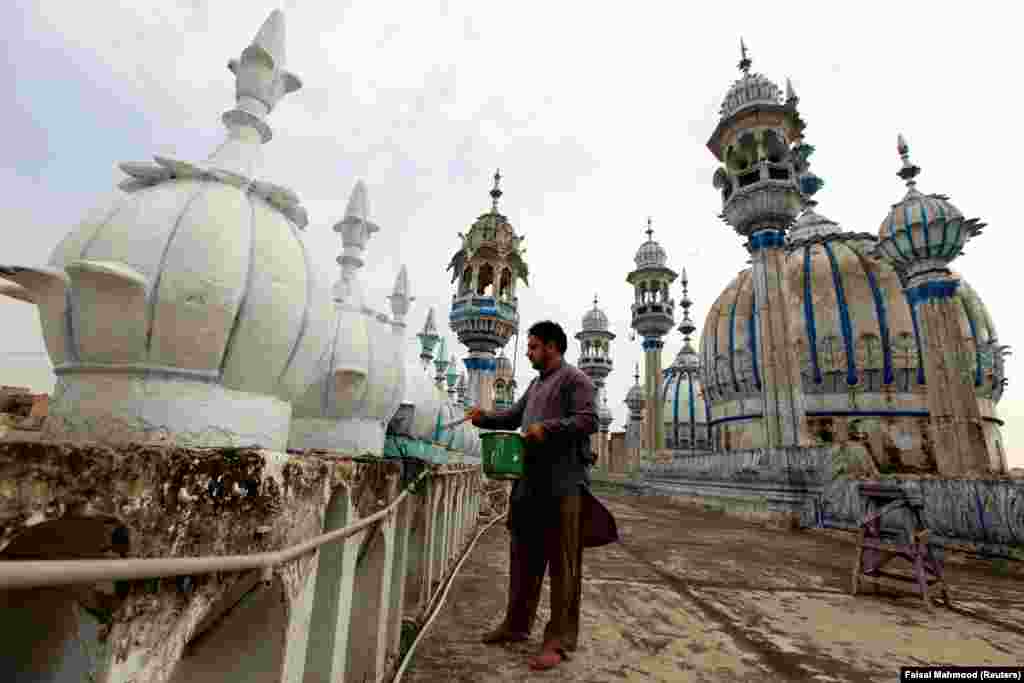 A man carries out cleaning work at a mosque ahead of the Muslim holy month of Ramadan in Rawalpindi, Pakistan, on May 15. (Reuters/Faisal Mahmood)