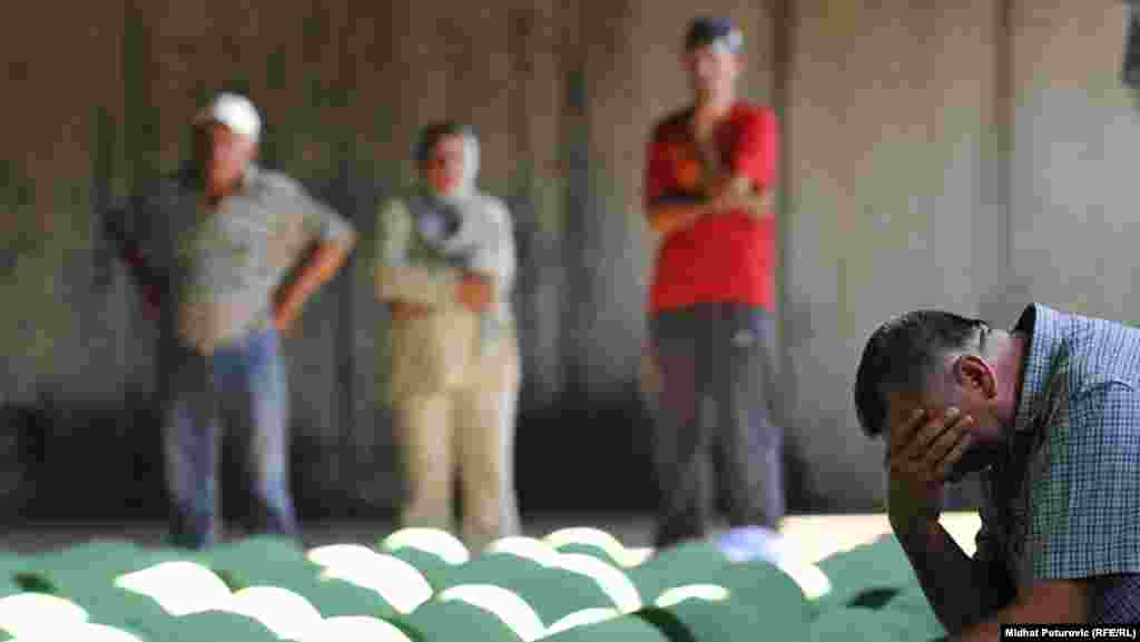 Bosnians who waited nearly 17 years for the identification of the remains of their loved ones and a chance to see them receive a proper burial grieve in Potocari on July 9.