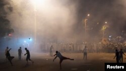 Armenia - Demonstrators who had gathered in a show of support for gunmen holding several hostages in a police station, clash with riot police in Yerevan, Armenia, July 20, 2016