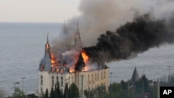 Building burns after missile attack by Russian forces on Odesa on April 29.