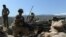 FILE: U.S. soldiers take up positions during an operation against the Islamic State (IS) militants in Nangarhar province.
