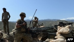 FILE: U.S. soldiers take up positions during an operation against Islamic State (IS) militants in Achin district of Nangarhar province in April 2017.