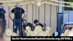 A photo of some of the Tornado detainees, taken outside Kyiv's Obolon district court in August 2016. Twelve Tornado members are now on trial behind closed doors.