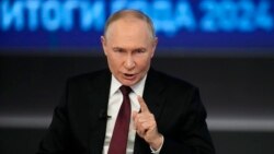 Președintele rus Vladimir Putin gesticulează în timpul unei sesiuni de întrebări și răspunsuri la Moscova pe 19 decembrie.