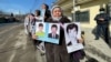 Qalida Akytkhan (center) takes part in a protest near the Chinese Consulate in Almaty in early March.