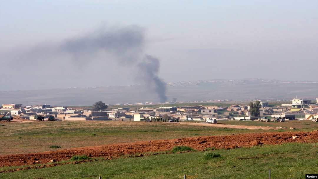 Smoke rises during clashes between Kurdish peshmerga fighters and Islamic State (IS) militants, on the outskirts of Mosul, in late January.