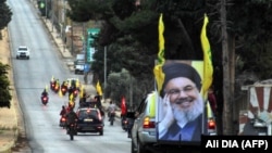 Supporters of the Hezbollah movement drive in a convoy in support of Nasrallah's speech, on the border with Israel on October 25, 2019. FILE PHOTO