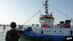 FILE: Pakistani soldiers stand guard at the port of Gwadar in the southwestern province of Balochistan.