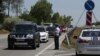 Armenia -- A police officer monitors cars entering Yerevan to see if their drivers and passengers wear face masks, June 1, 2020. 