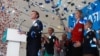 Aleksei Navalny (left) addresses his supporters in Moscow on December 24.