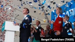 Aleksei Navalny (left) addresses his supporters in Moscow on December 24.