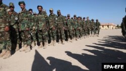 Afghan commandos attend a graduation ceremony after military training in Herat.