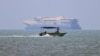 Vessels in the Strait of Hormuz near the beach of Bandar Abbas, Iran, on June 17