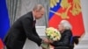 RUSSIA - Russia's President Vladimir Putin (L) and Lyudmila Alekseyeva, chairperson of the Moscow Helsinki Group, who has received the national award for outstanding achievements in human rights activity, during a ceremony to present the 2017 State Awards