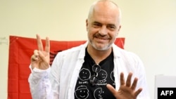 Albanian Prime Minister Edi Rama, poses after casting his ballot in the village of Surrel, near Tirana, on June 25.