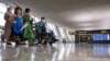 Afghan refugees arrive at Dulles International Airport in Washington, D.C., on August 27.