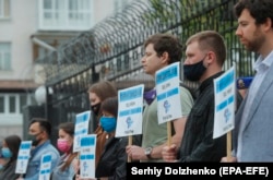 Protesters hold banners with the names of missing Crimean activists during a protest in front of the Russian Embassy in Kyiv on May 26.