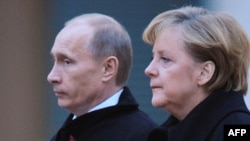 Russian Prime Minister Vladimir Putin (left) will meet with German Chancellor Angela Merkel later today.