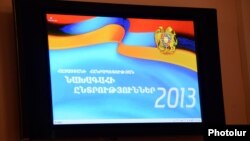 Armenia -- The official banner of the February 2013 presidential elecition projected from a monitor at the Central Election Commission, Yerevan, 14Jan2013.