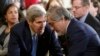 U.S. Secretary of State John Kerry confers with Afghan Chief Executive Abdullah Abdullah prior to a joint news conference by U.S. President Barack Obama and Afghan President Ashraf Ghani at the White House on March 25.