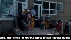 Uzbekistan - people are waiting to take money from People's bank of Uzbekistan in Ferghana region, 12 July 2014.