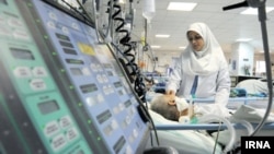 A nurse attending a patient in an Iranian hospital. File photo