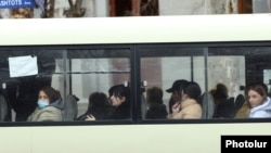 Armenia - Passengers on a commuter bus in Yerevan, March 12, 2021.