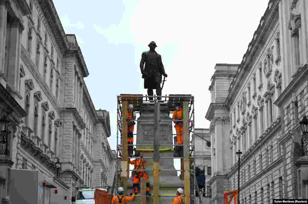 Workers assemble scaffolding around the statue of Robert Clive in Whitehall, following the death of George Floyd who died in police custody in Minneapolis, London, Britain, June 12, 2020.