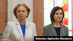 MOLDOVA -- (R-L) Moldovan Prime Minister Maia Sandu, Parliament Speaker Zinaida Greceanii and President Igor Dodon, who was temporarily relieved of his duties by a Moldovan court to allow a stand-in to call a snap election, attend new ministers' swearing-