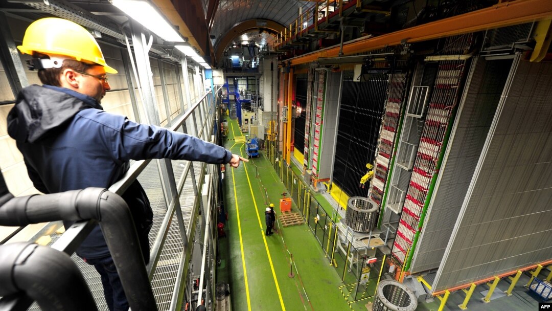 A file photo shows scientists looking at equipment at the Gran Sasso National Laboratory as part of a repeat experiment in cooperation with the European Organization for Nuclear Research.