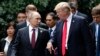 U.S. President Donald Trump (right) and Russian President Vladimir Putin talk during the Asia-Pacific Economic Cooperation summit in Vietnam on November 11.