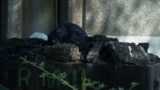 Zenica, Bosnia and Herzegovina -- A close-up of a cart with coal at the entrance to the Zenica coal mine