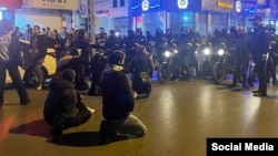 Protesters attend a sit-in demonstration against economic hardships in the Iranian city of Mashhad on January 2. 