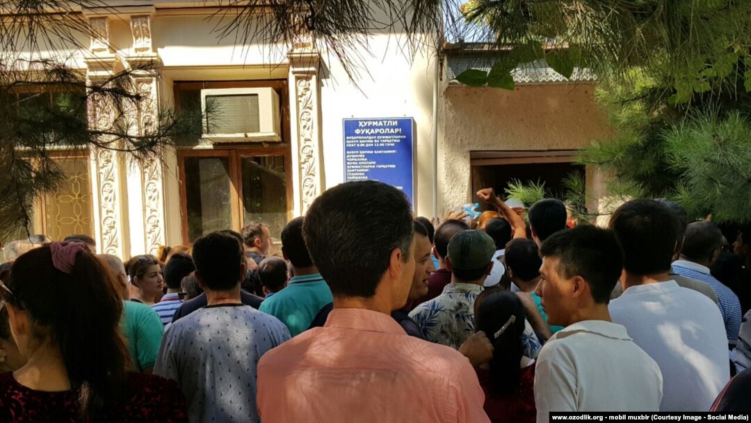 Uzbekistan - queue next passport desk to take new passport in Samarkand