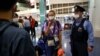 Kristina Timanovskaia la aeroportul din Tokyo, unde a refuzat să fie repatriată „cu forța” in Belarus, 1 august 2021.