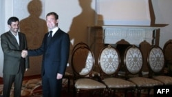 Iranian President Mahmud Ahmadinejad (left) and Russian President Dmitry Medvedev meet the media at a 2008 gathering in Dushanbe.