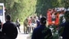 WATCH: Local media showed chaotic scenes after a blast in Kerch, Crimea, with one injured man being driven away on the back of a truck while other people held a drip he was connected to. 