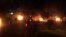 Dozens of protesters gathered outside the Iranian Consulate in Karbala on May 9, setting fire to the perimeter wall, a gate, and trailers outside.