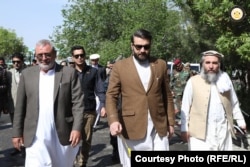 Former Afghan National Security Adviser Hamdullah Mohib (center) and other officials of the ousted government visiting Ghazni Province in April.