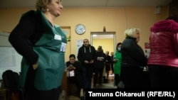 An observer monitoring the voting in Temka