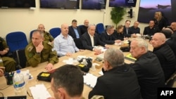 Israeli Prime Minister Benjamin Netanyahu (center) attends a war cabinet meeting at the Kirya in Tel Aviv on April 14. 