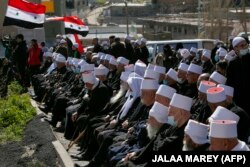 تجمع دروزی‌های مجدل شمس در بلندی‌های جولان در اعتراض به اعلام الحاق جولان به اسرائیل در ۱۴ فوریه ۲۰۲۱