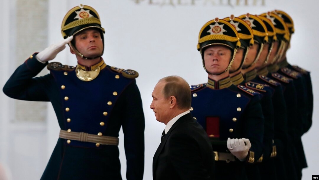 Russian President Vladimir Putin (center) enters the hall for the State Prize awards ceremony at the Grand Kremlin Palace in Moscow on June 12.