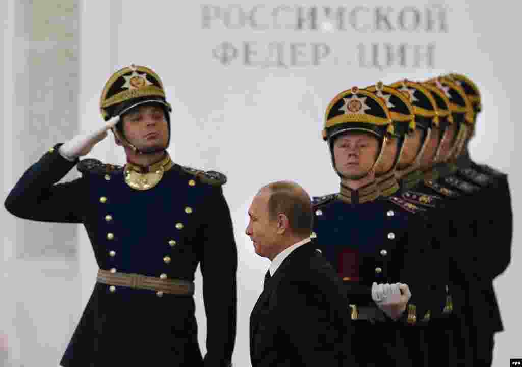 Russian President Vladimir Putin enters the hall for an awards ceremony at the Grand Kremlin Palace in Moscow on June 12. (epa/Sergei Ilnitsky)