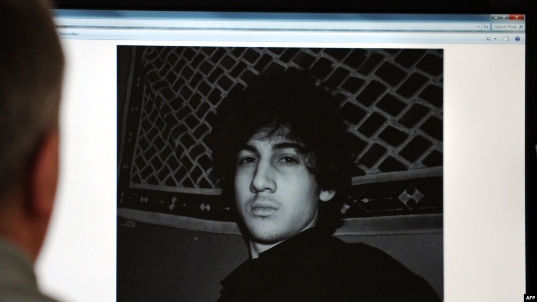 A man in Moscow looks at a computer screen displaying an undated picture of the 19-year-old Dzhokhar Tsarnaev posted on his page on vKontakte, a Russian social-media site, on April 19.