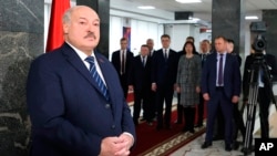 Belarusian leader Alyaksandr Lukashenka addresses the media after voting at a polling station in Minsk in February.